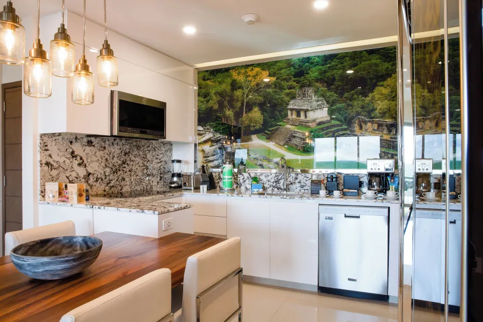 One Bedroom Swim Up kitchen and dining area at Garza Blanca Resort & Spa Cancun.