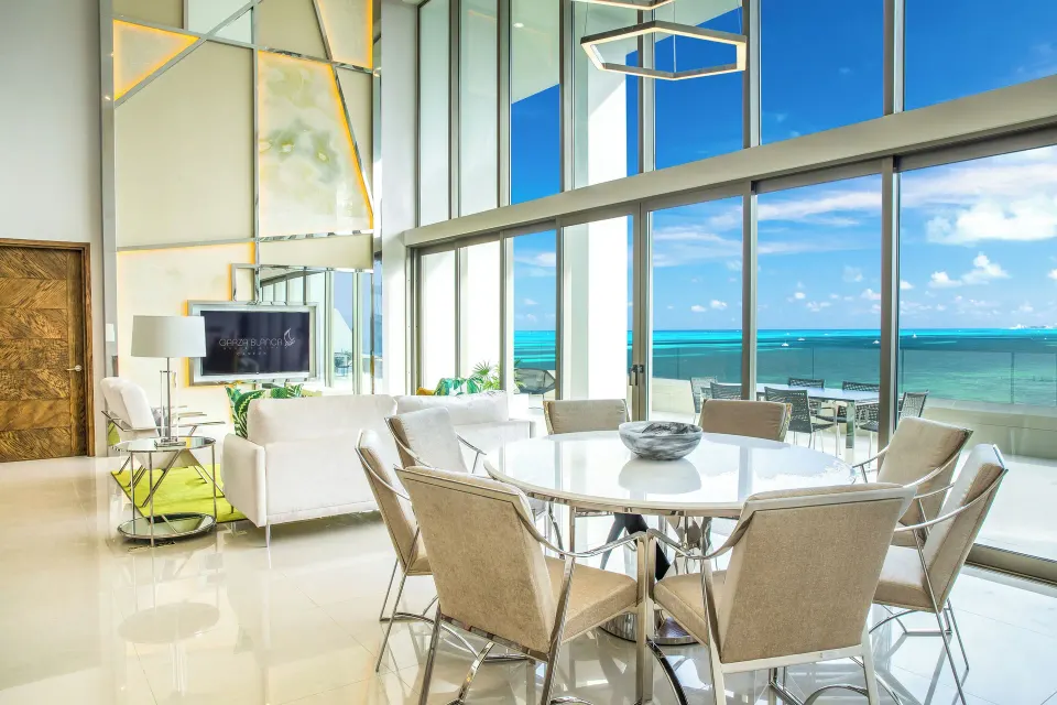 Double-height living and dining area in a Three Bedroom Loft at Garza Blanca Resort & Spa Cancun.