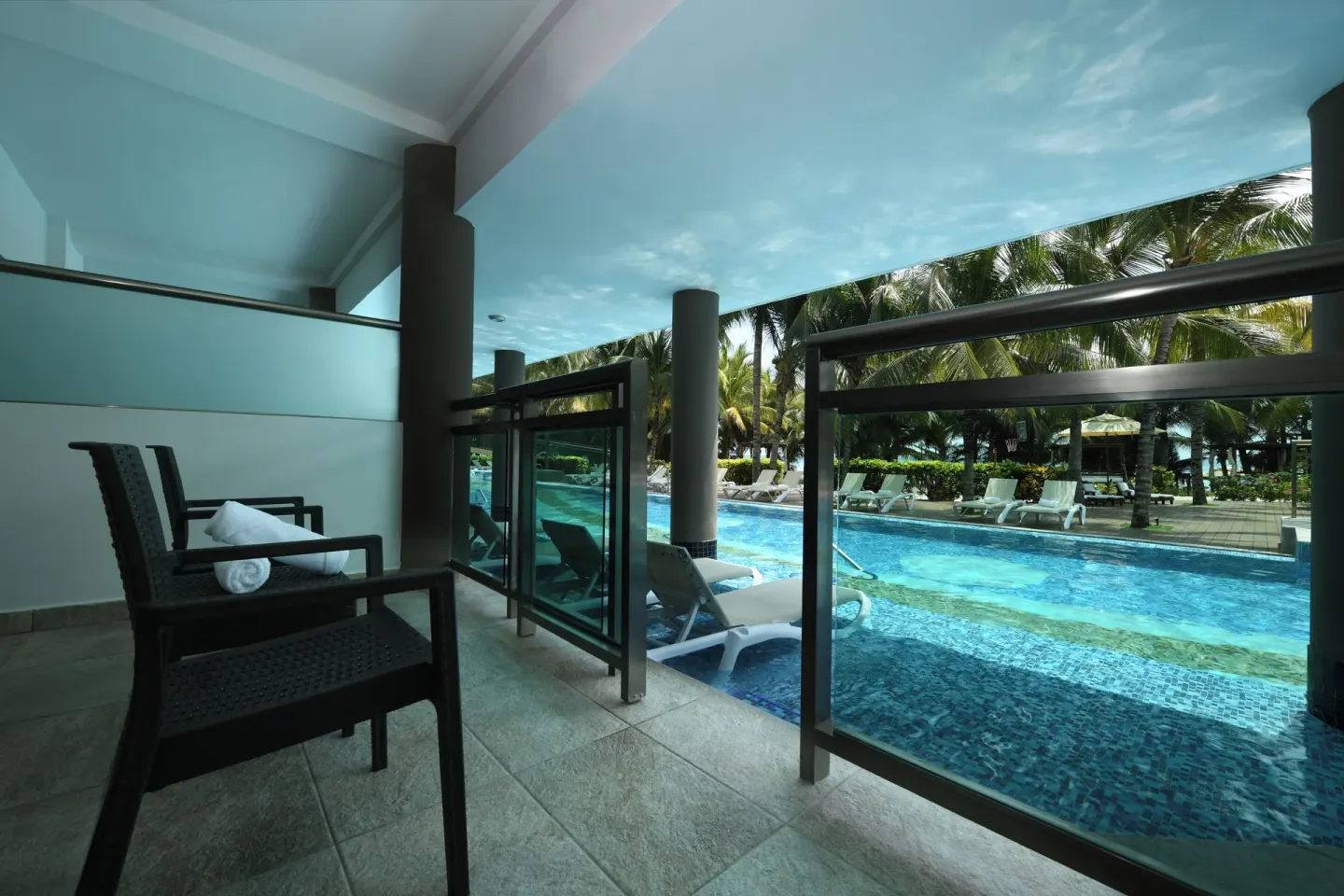 Oceanfront Pool Swim Up Suite terrace beside the pool at Generations Riviera Maya.