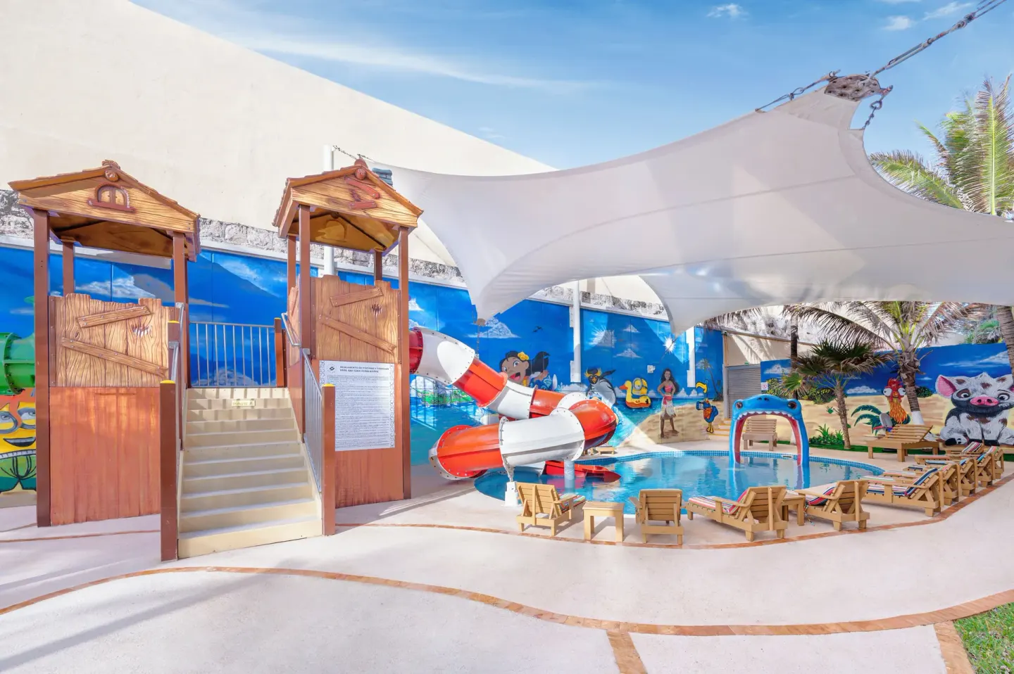 Children’s water play area with slide tower and shade canopy at GR Solaris Cancun & Spa.