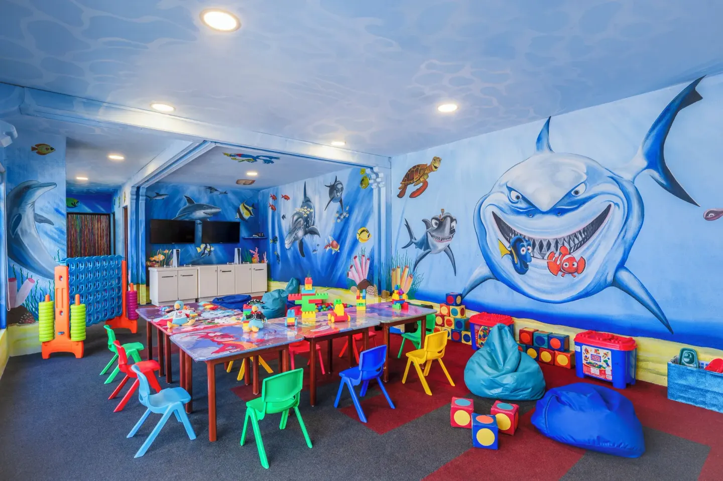Kids club playroom with sea murals and activity tables at GR Solaris Cancun & Spa.