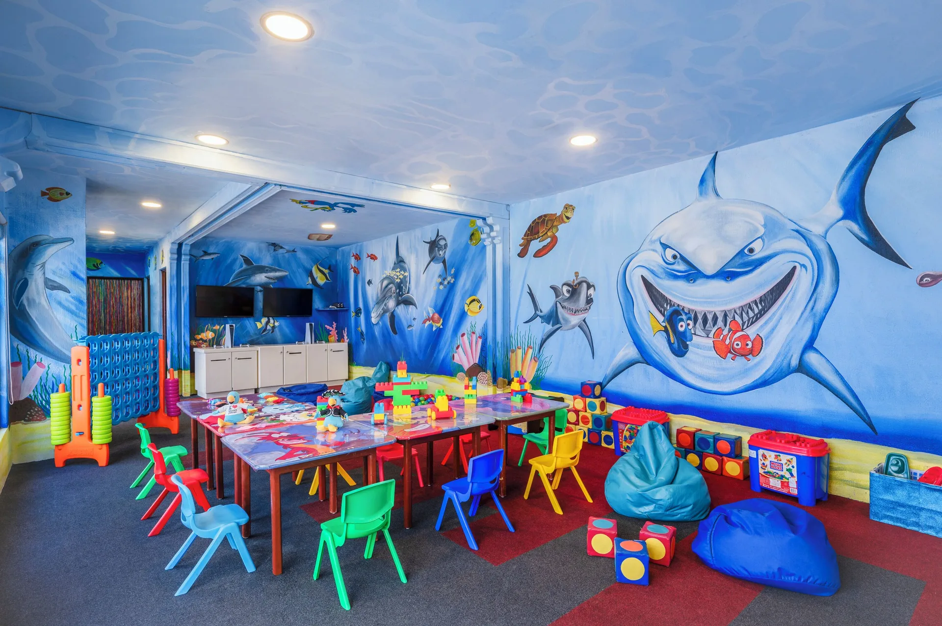 Kids club playroom with sea murals and activity tables at GR Solaris Cancun & Spa.