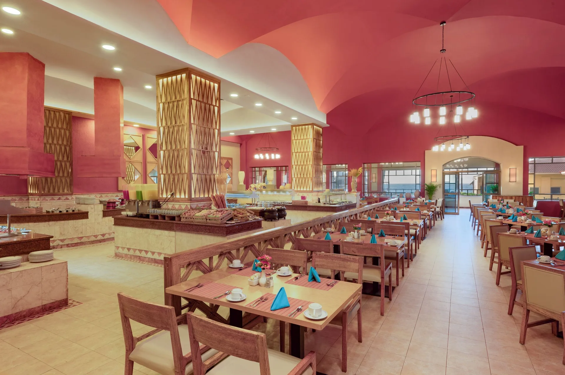 Buffet dining room with pink arches at GR Solaris Cancun & Spa.