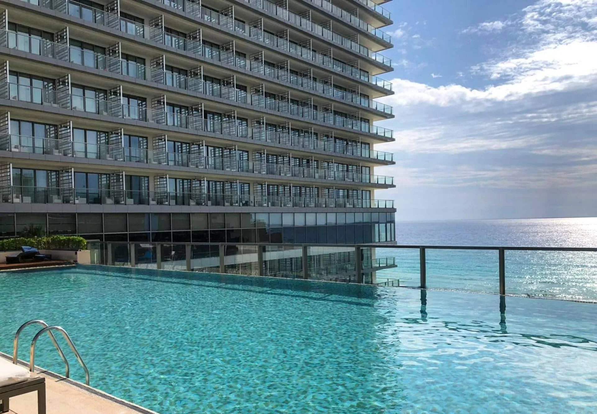Secrets The Vine Cancun adults-only all-inclusive resort with modern towers and ocean-view pools