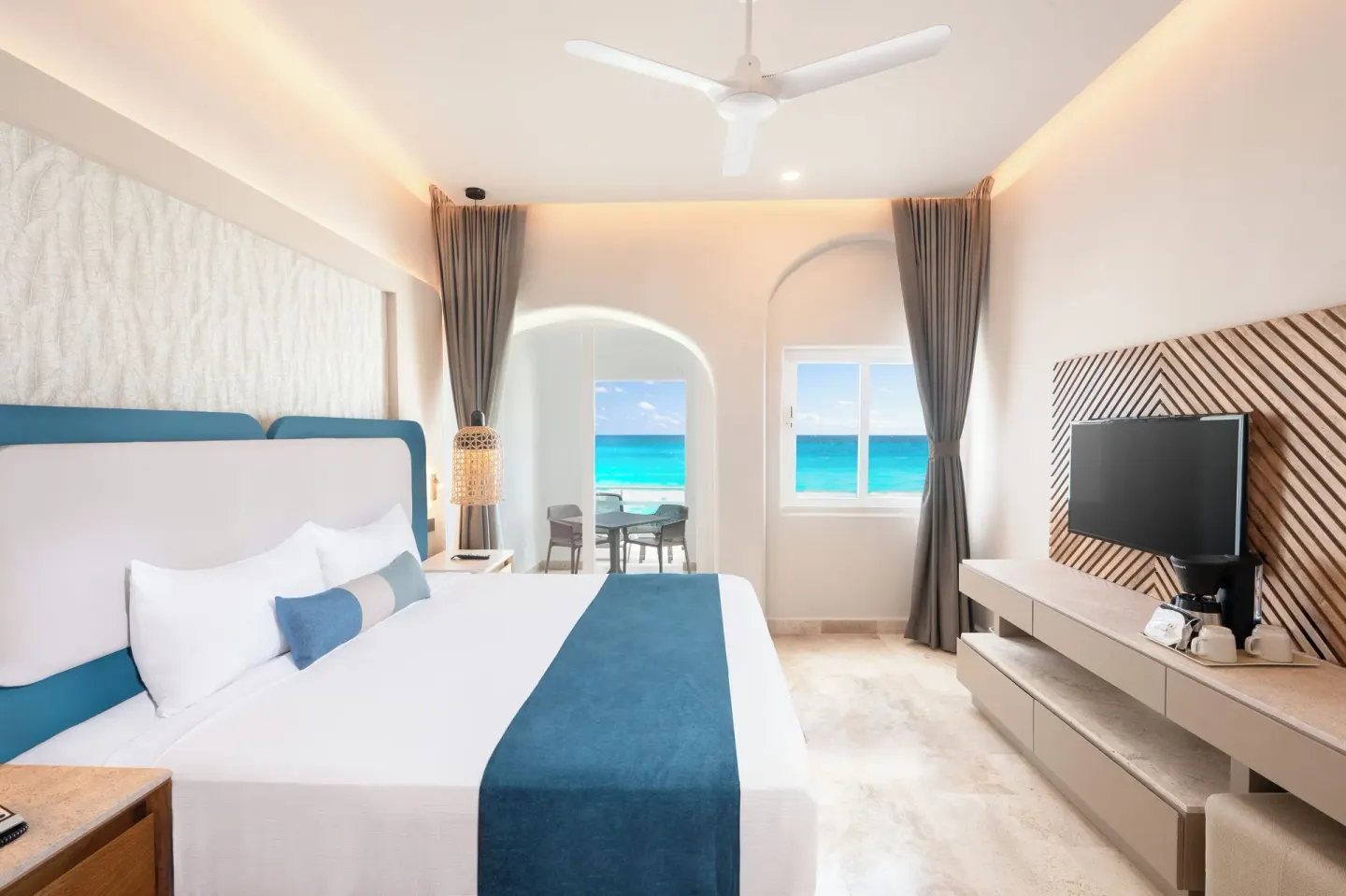 Beachfront room with king bed and ocean view at GR Solaris Caribe.