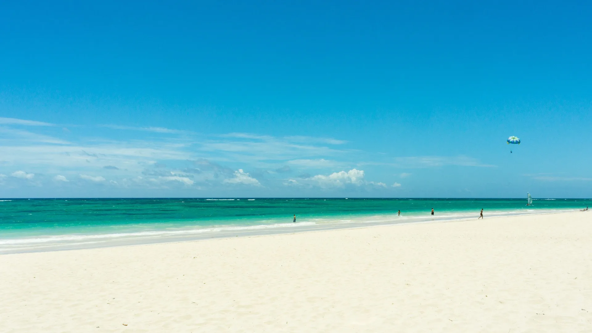 Wide white-sand beach and turquoise sea at Grand Bavaro Princess.
