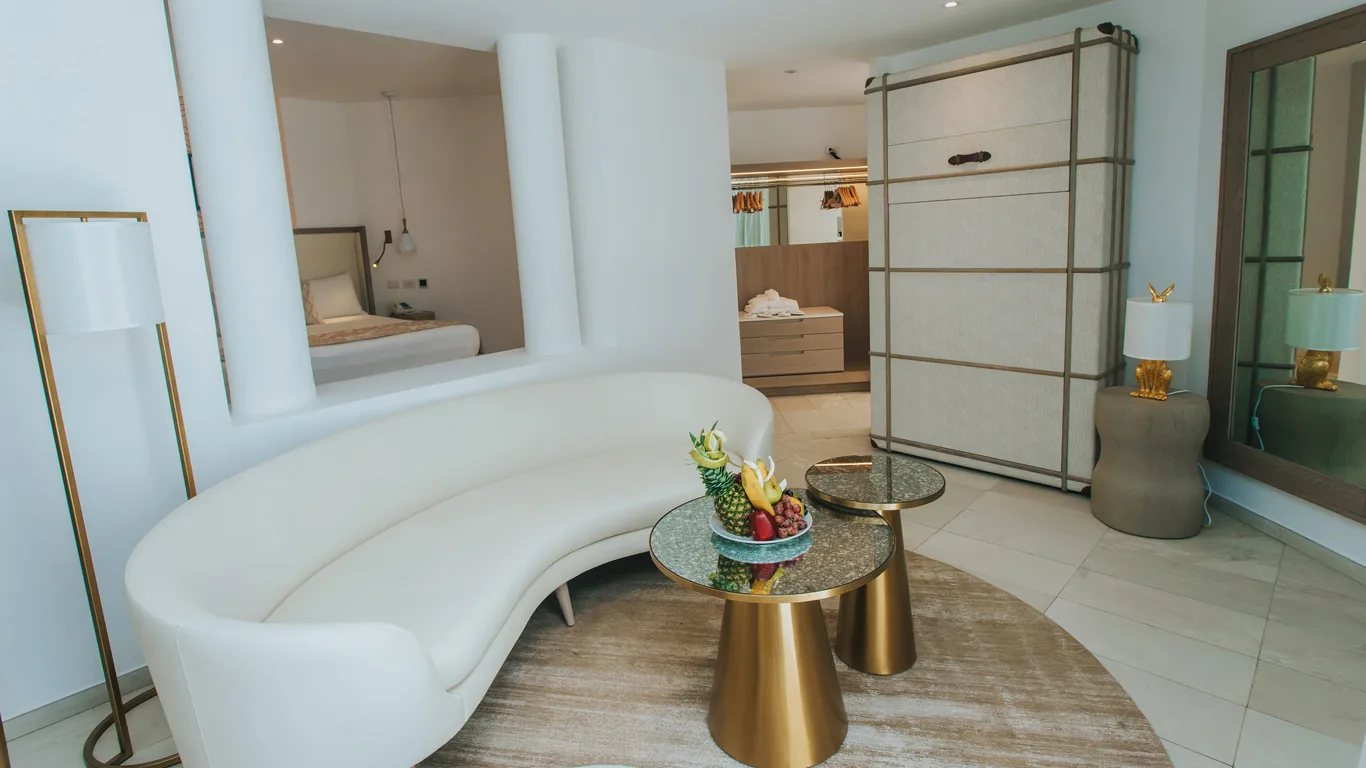 Platinum Suite lounge with fold-away Murphy bed cabinet and dressing area at Grand Bavaro Princess.
