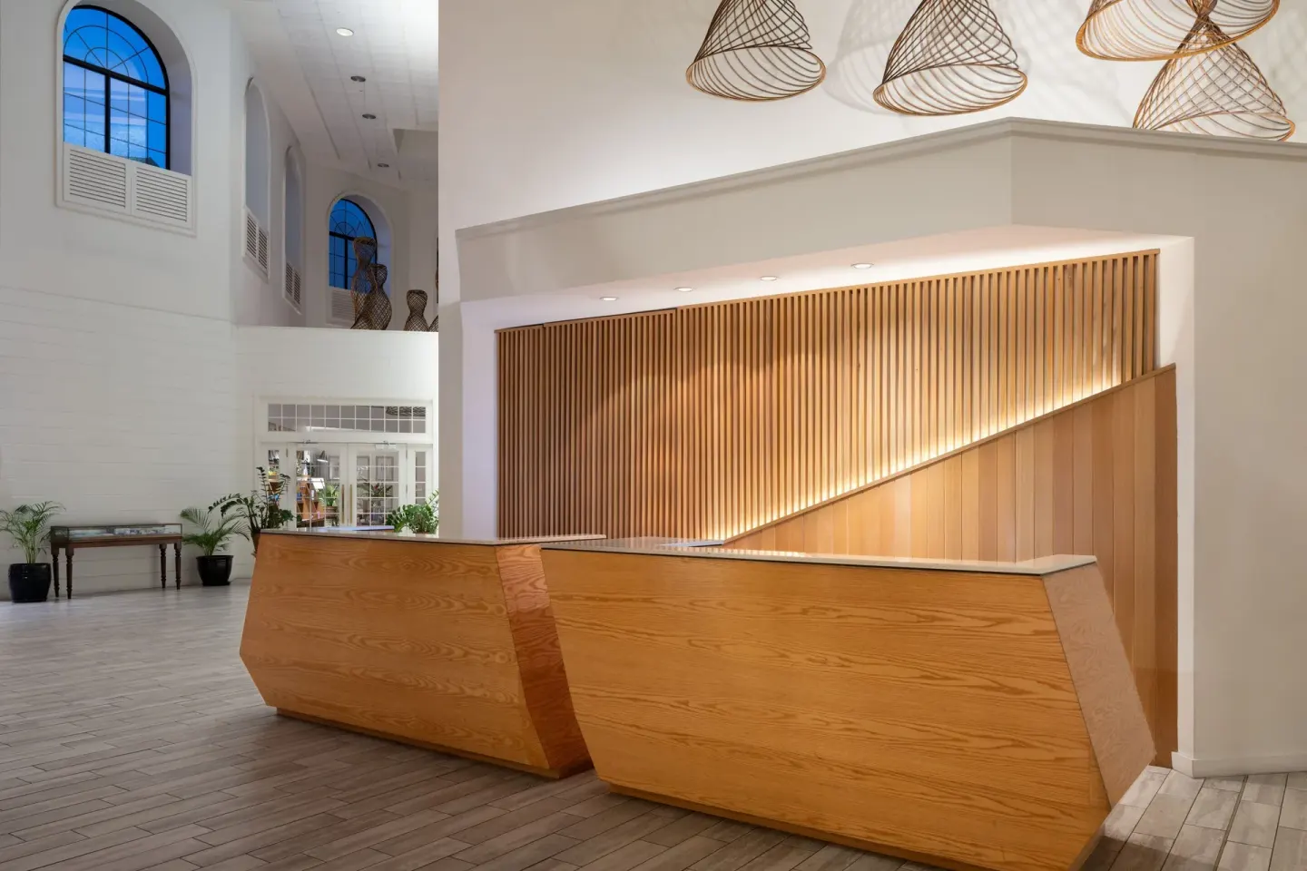 Wood reception desks in the bright lobby at Grand Cayman Marriott Resort.