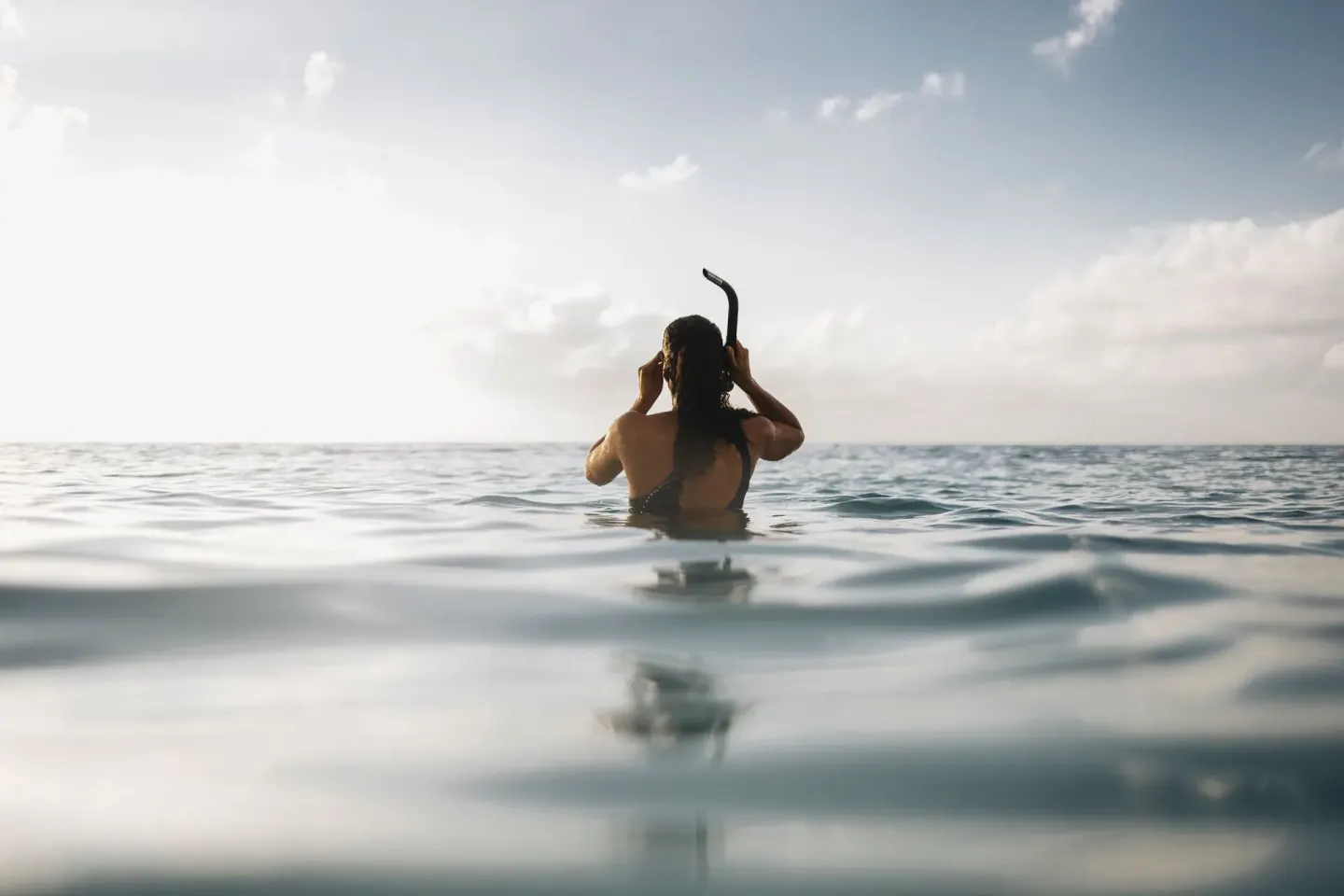 Snorkeler at the ocean surface near Grand Cayman Marriott Resort.