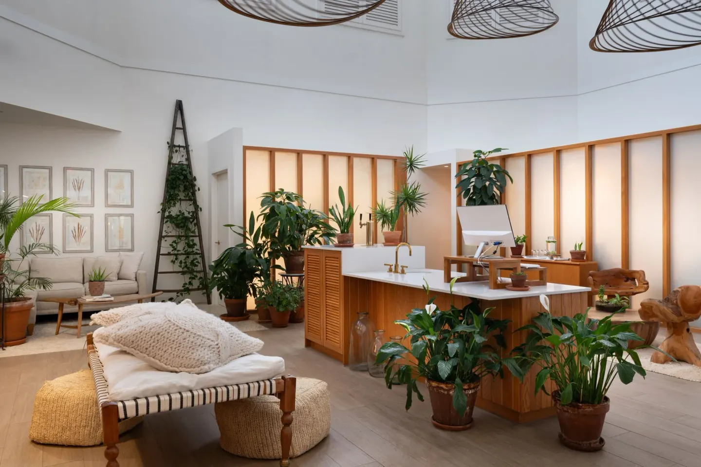Plant-filled lobby lounge with wood counters at Grand Cayman Marriott Resort.