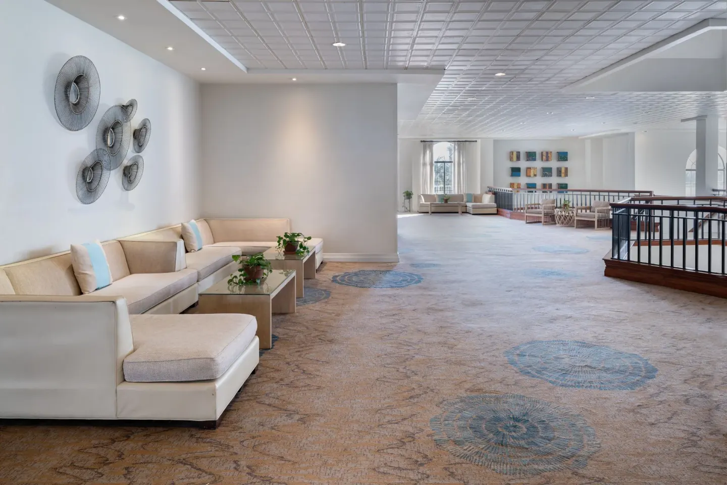 Lounge seating in an upper-level corridor at Grand Cayman Marriott Resort.