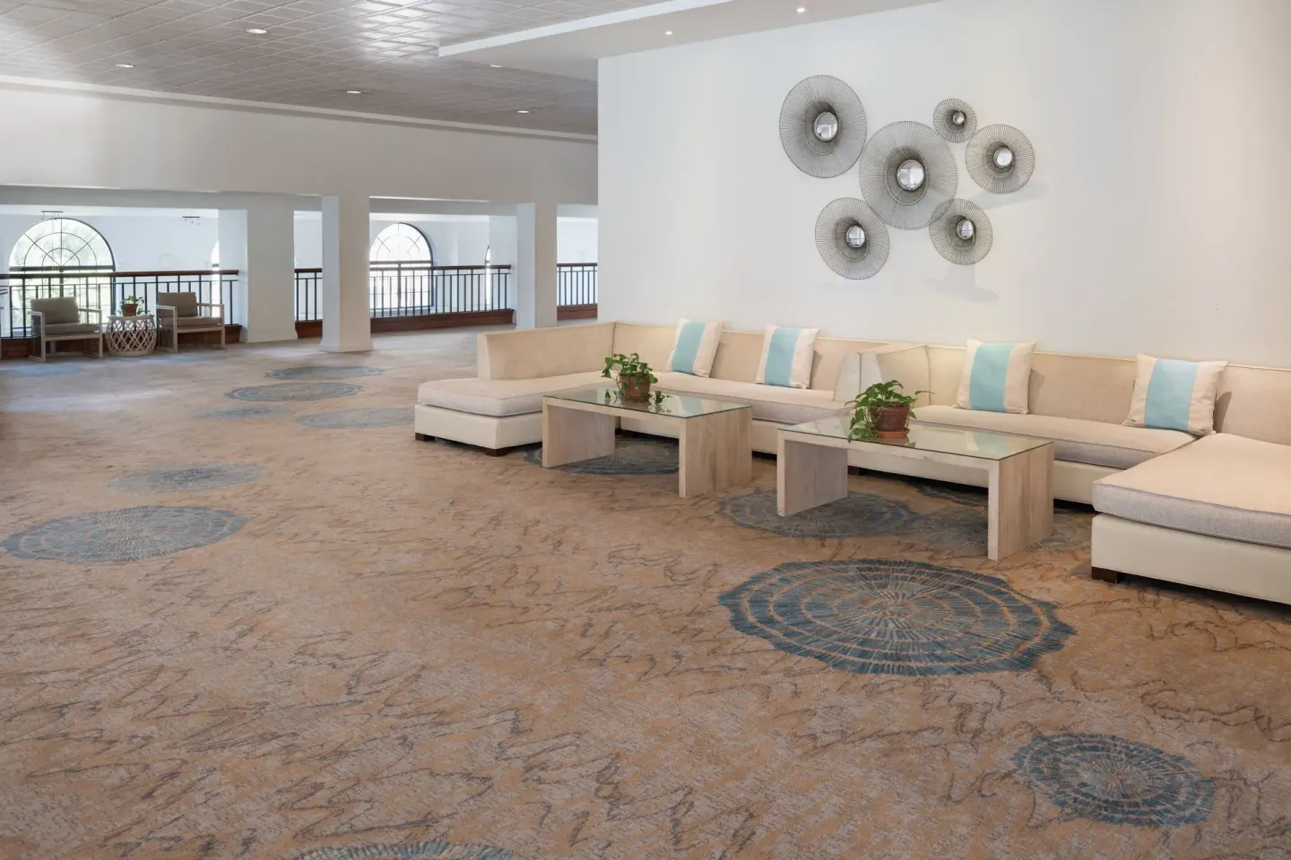 Upper-level lounge with sectional sofas at Grand Cayman Marriott Resort.