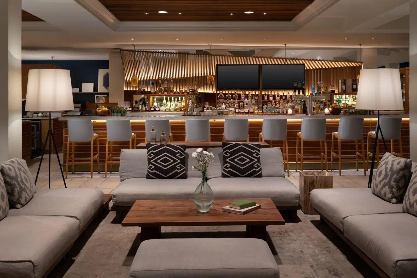 Lounge seating facing a backlit bar at Grand Cayman Marriott Resort.