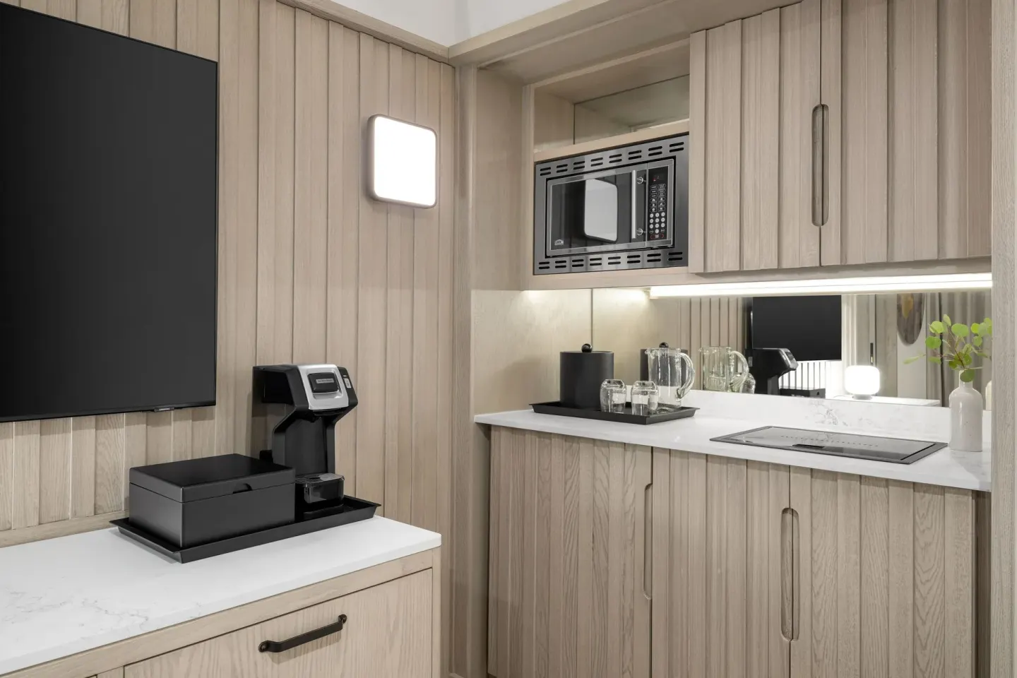 Oceanfront suite wet bar with microwave and coffee setup at Grand Cayman Marriott Resort.