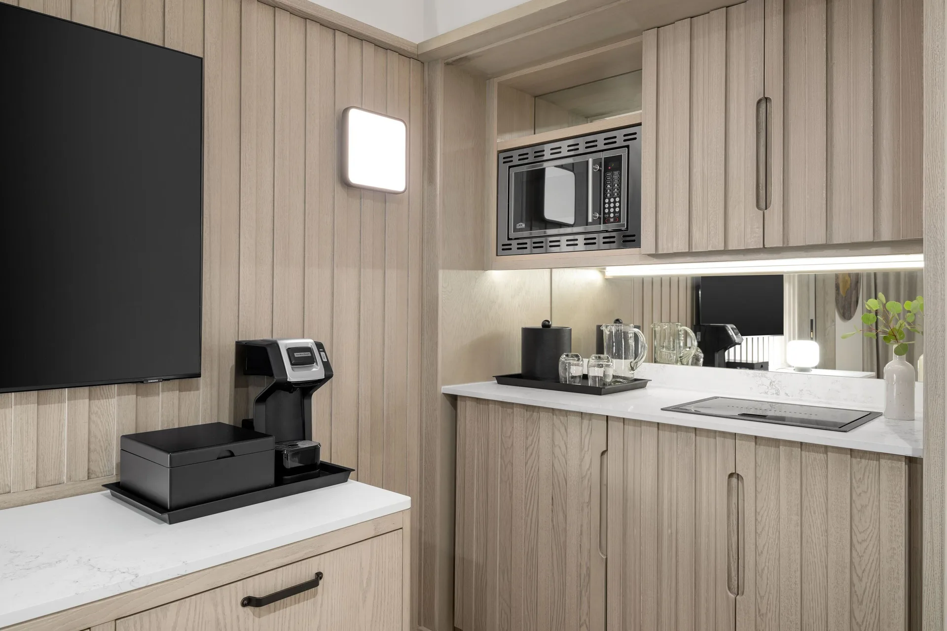 Oceanfront suite wet bar with microwave and coffee setup at Grand Cayman Marriott Resort.