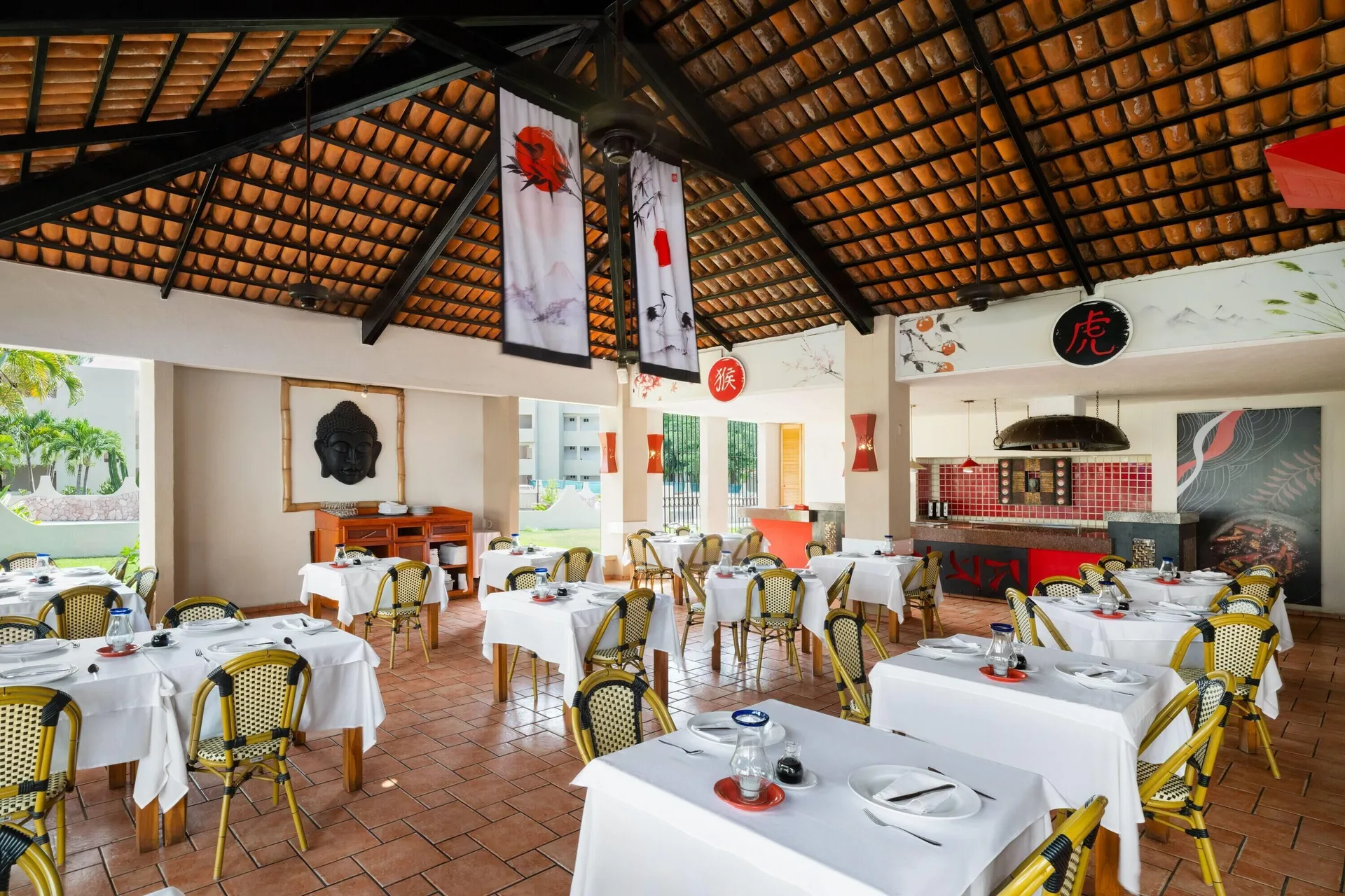 Japanese restaurant dining room with red accents at Grand Decameron Complex Bucerias.