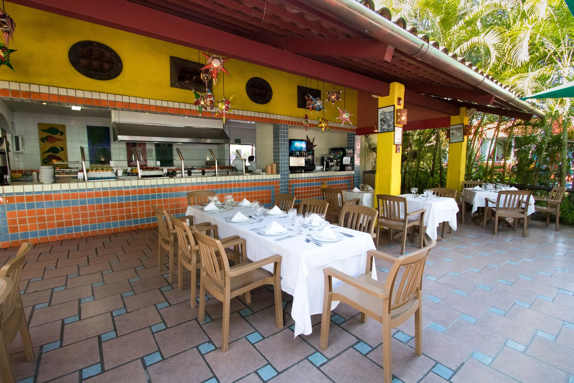 Covered Mexican-style dining patio with tiled service counter at Grand Decameron Complex Bucerias.