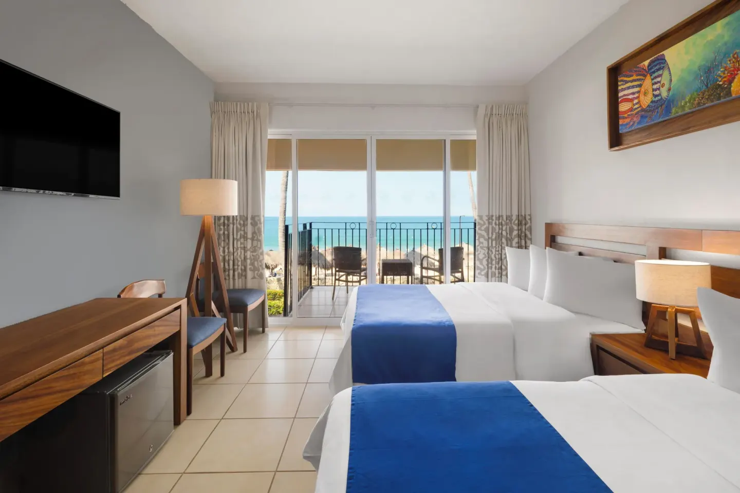 Ocean View Room with two beds and balcony facing the sea at Grand Decameron Complex Bucerias.