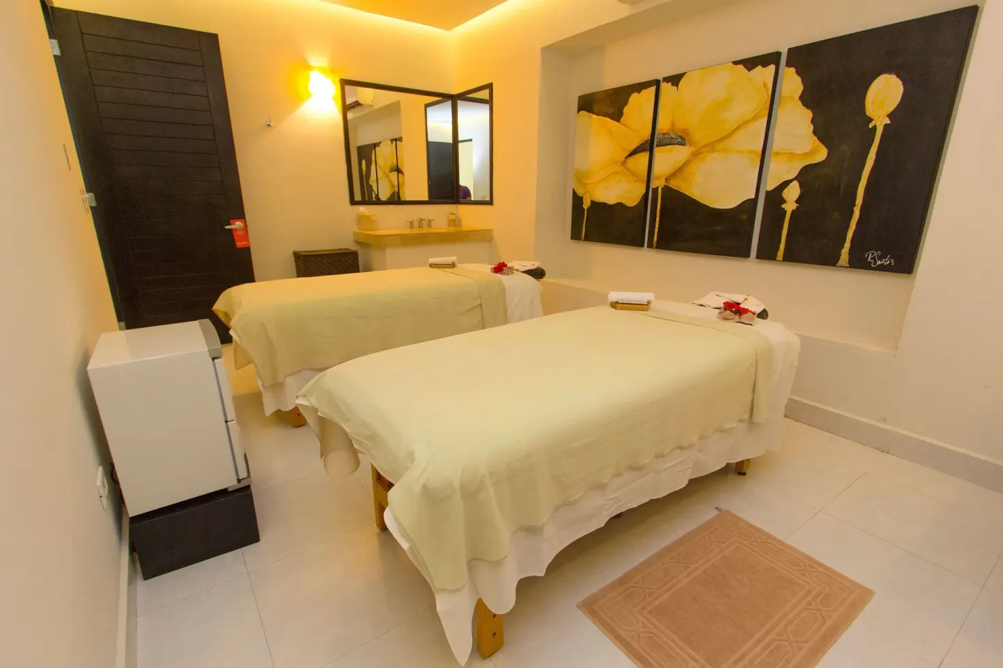 Couples spa room with two massage tables at Grand Decameron Los Cabos.