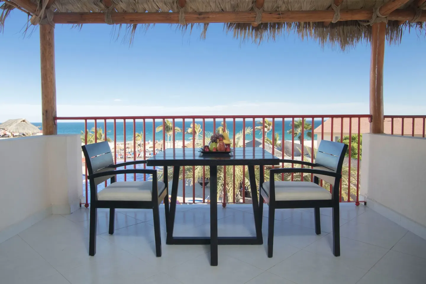 Ocean view balcony dining table at Grand Decameron Los Cabos.