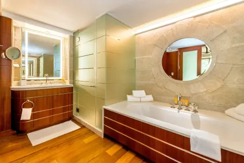 Guest room bathroom with soaking tub, shower and double vanity at Grand Hyatt Baha Mar.