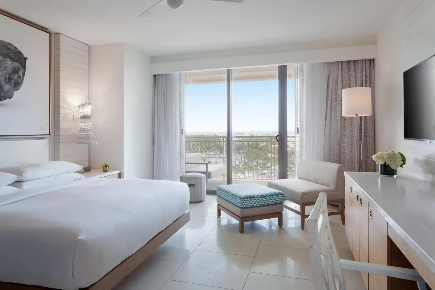 King guest room with balcony seating and ocean view at Grand Hyatt Baha Mar.