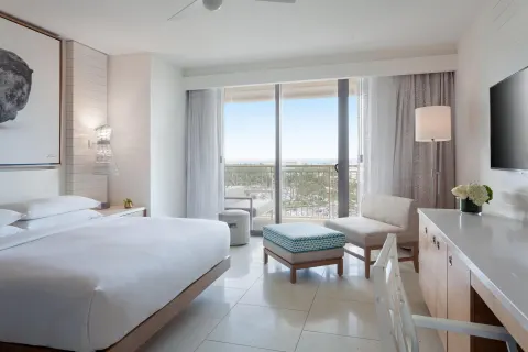 King guest room with balcony seating and ocean view at Grand Hyatt Baha Mar.