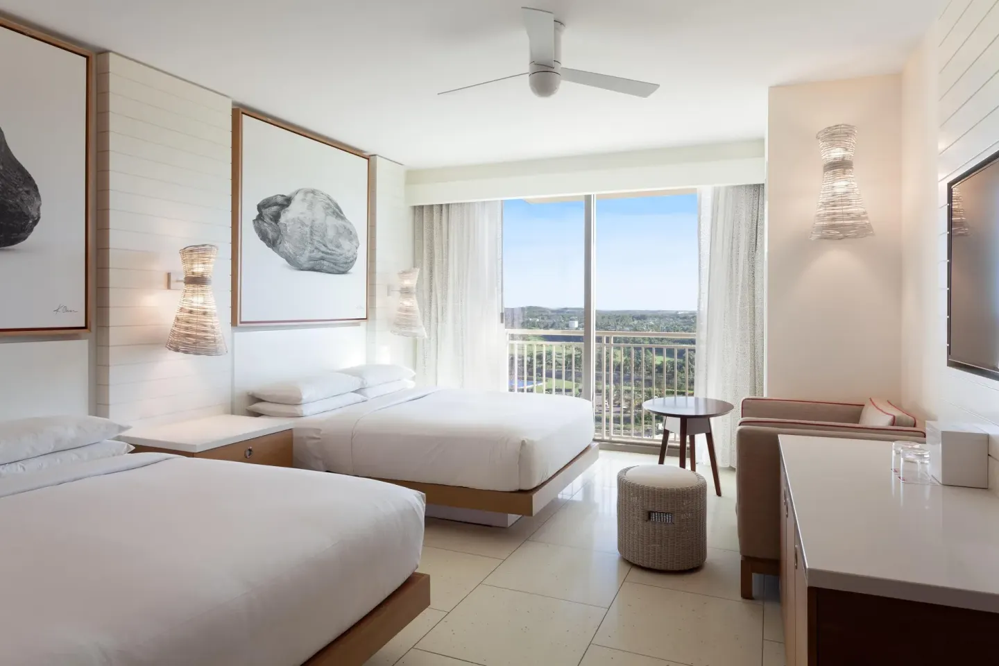 Two-bed guest room with balcony and resort view at Grand Hyatt Baha Mar.
