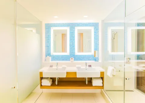 Double vanity bathroom in a Deluxe Room Ocean View residence at Grand Hyatt Baha Mar.