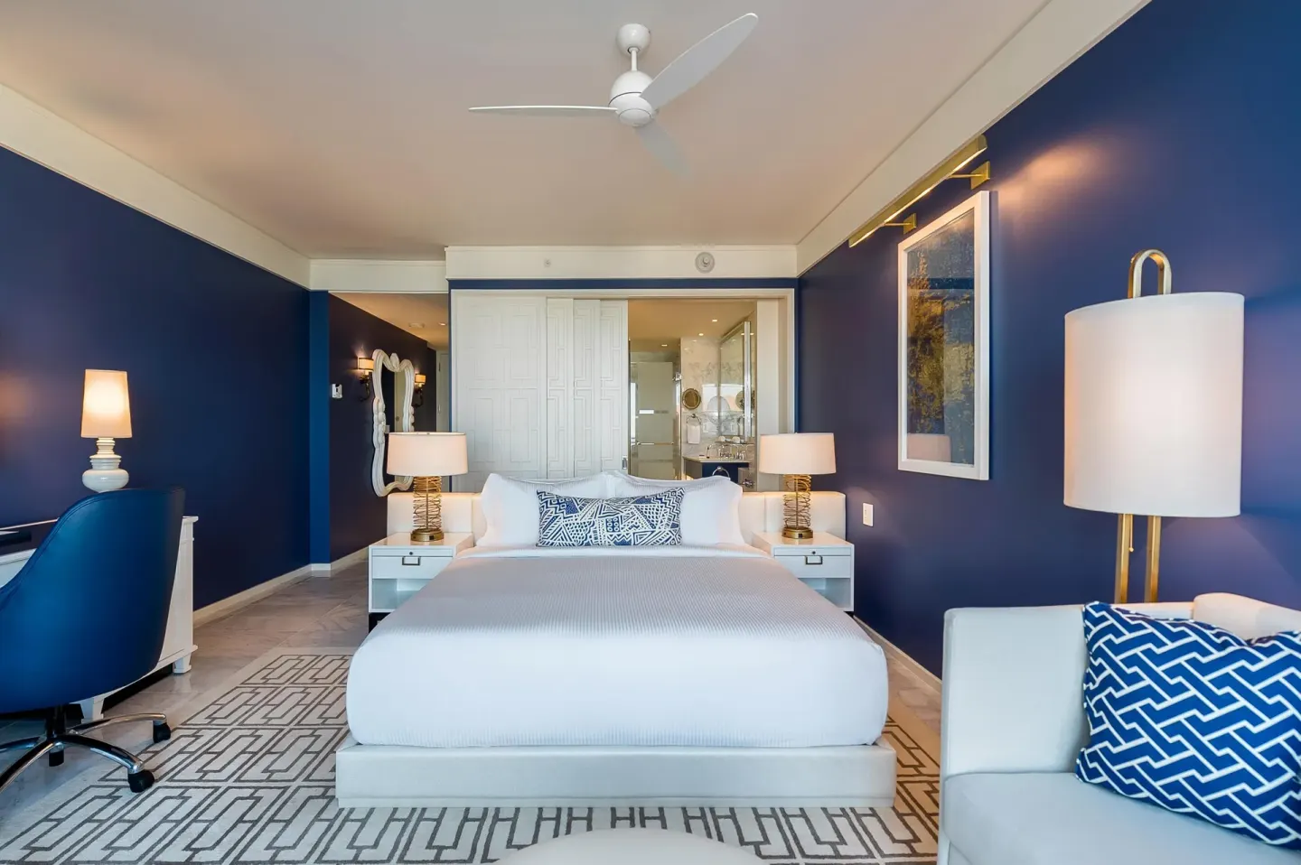 King-bed Grand Room at Grand Hyatt Baha Mar with blue walls, desk chair, and sofa detail.
