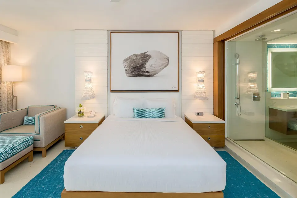 King-bed Grand Room at Grand Hyatt Baha Mar with glass shower wall and turquoise accents.