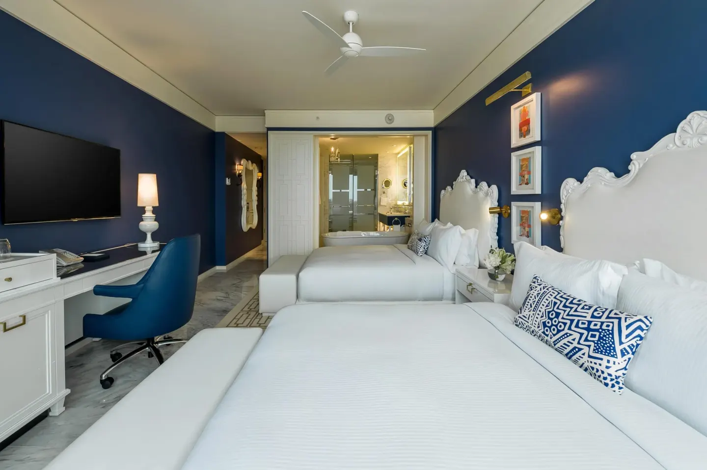 Grand Room at Grand Hyatt Baha Mar with two double beds, wall-mounted TV, desk, and bathroom view.