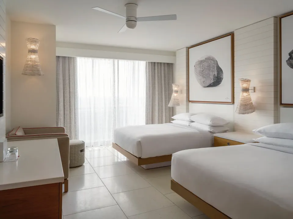Grand Room at Grand Hyatt Baha Mar with two double beds, desk area, and sheer window curtains.