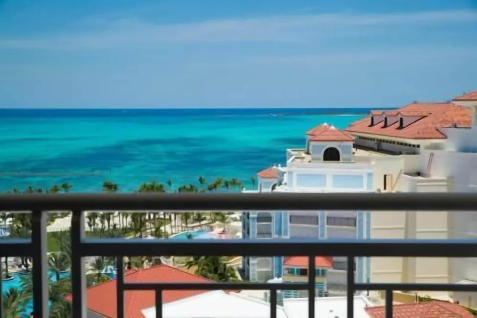 Ocean view from a room balcony at Grand Hyatt Baha Mar with turquoise water and resort rooftops.