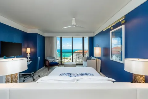 Ocean View king room with blue walls and balcony at Grand Hyatt Baha Mar.