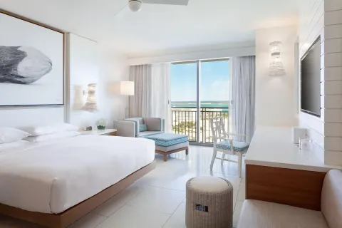 Ocean View king room with chaise, desk, and balcony at Grand Hyatt Baha Mar.