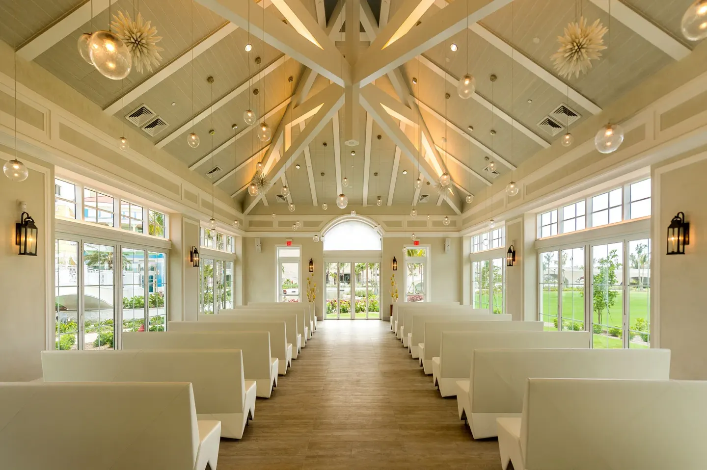 White chapel-style event room with benches and vaulted ceiling at Grand Hyatt Baha Mar.