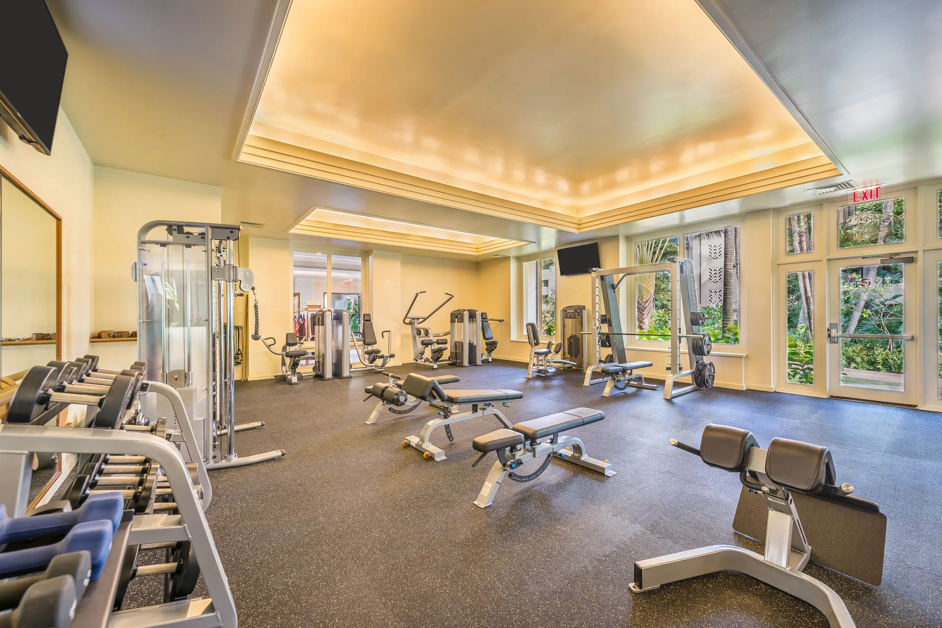 Fitness center with weights and exercise machines at Grand Hyatt Kauai Resort and Spa and Spa.