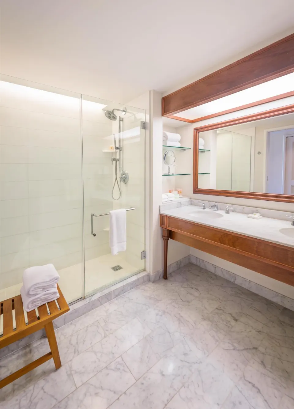 Glass shower and marble vanity bathroom at Grand Hyatt Kauai Resort and Spa and Spa.