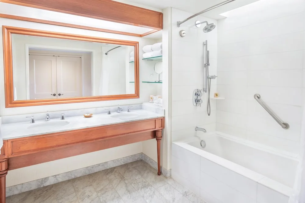 Guest bathroom with soaking tub and double vanity at Grand Hyatt Kauai Resort and Spa and Spa.