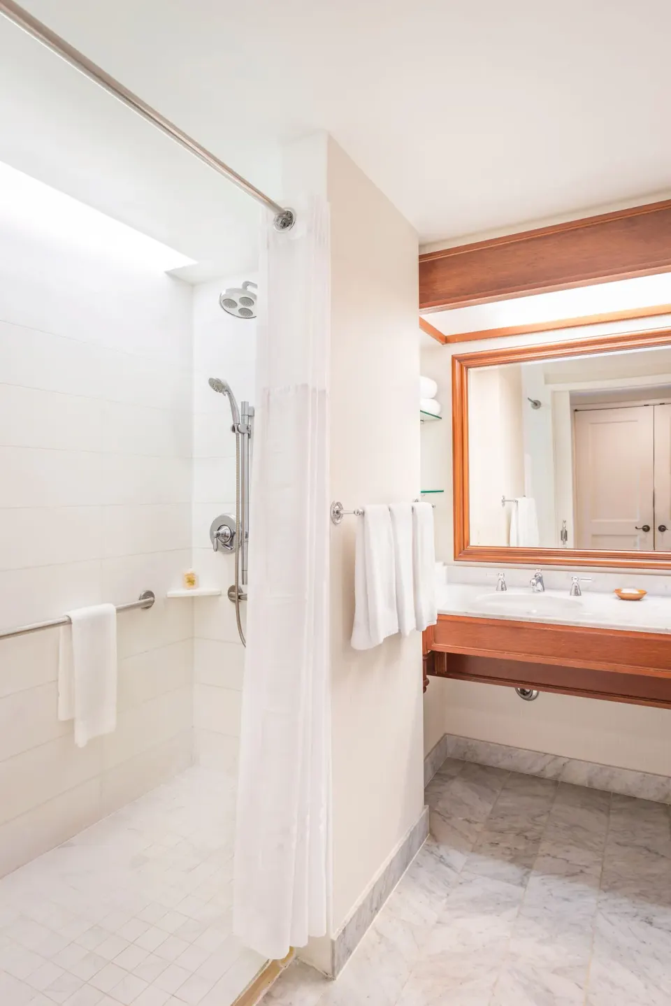 Bathroom with walk-in shower and vanity at Grand Hyatt Kauai Resort and Spa and Spa.