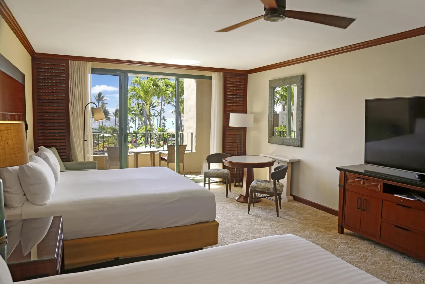 Guest room with two beds and balcony view at Grand Hyatt Kauai Resort and Spa and Spa.