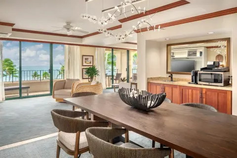 Ocean-view suite dining and living area at Grand Hyatt Kauai Resort and Spa and Spa.