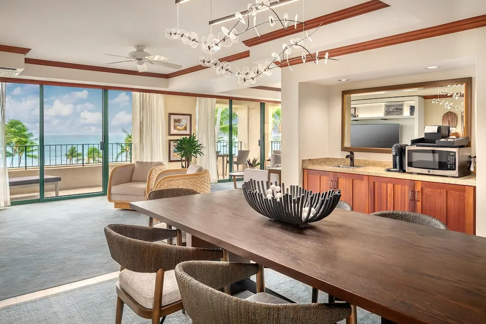 Ocean-view suite dining and living area at Grand Hyatt Kauai Resort and Spa and Spa.