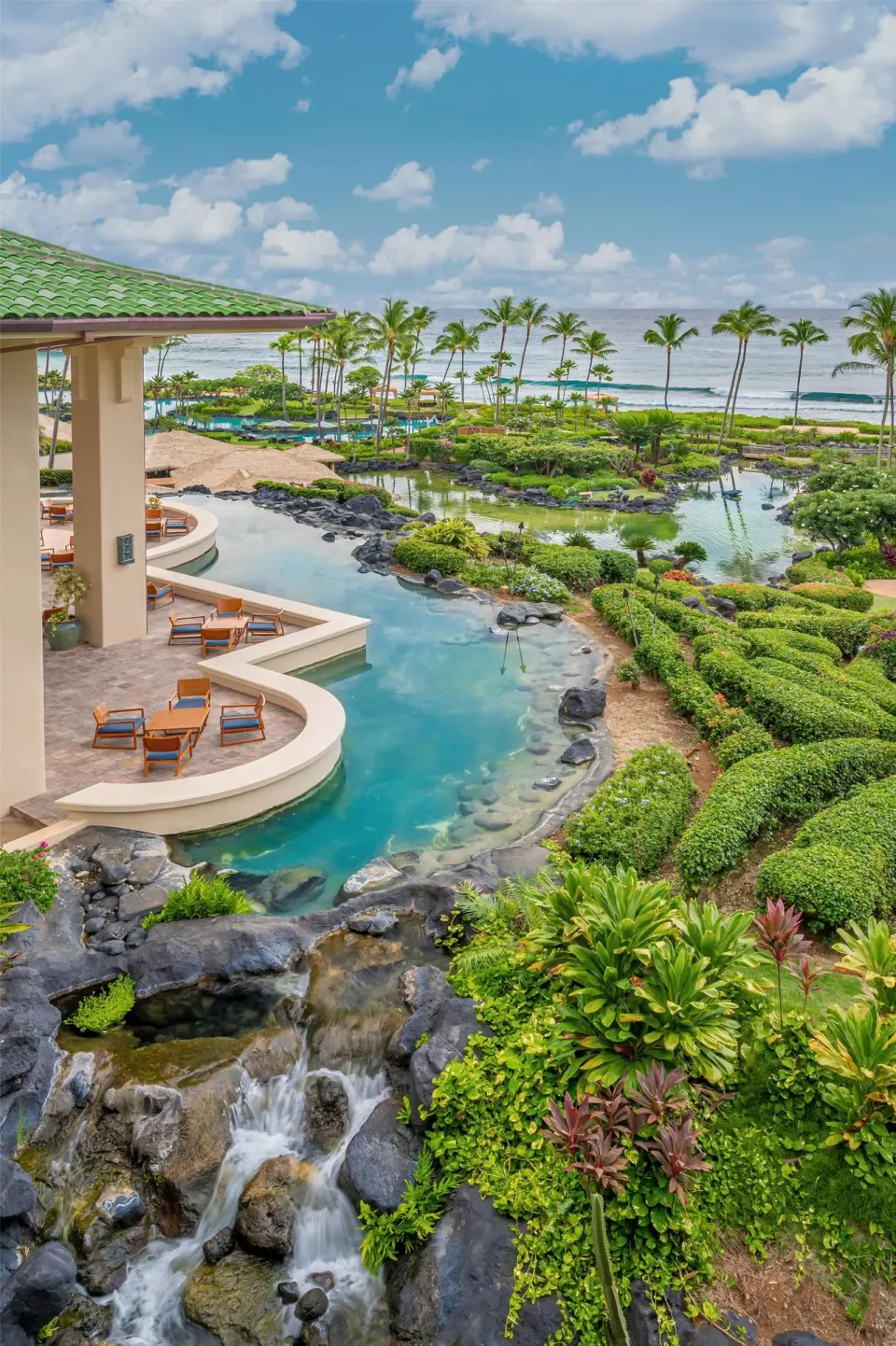 Oceanfront gardens, lagoon, and waterfall at Grand Hyatt Kauai Resort and Spa and Spa.