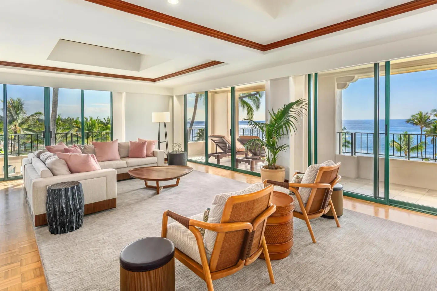 Oceanfront suite living room with balconies and lounge seating at Grand Hyatt Kauai Resort and Spa and Spa.