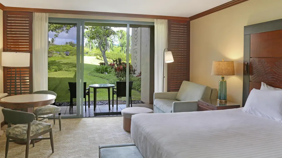 Garden View room with king bed and lanai at Grand Hyatt Kauai Resort and Spa and Spa.