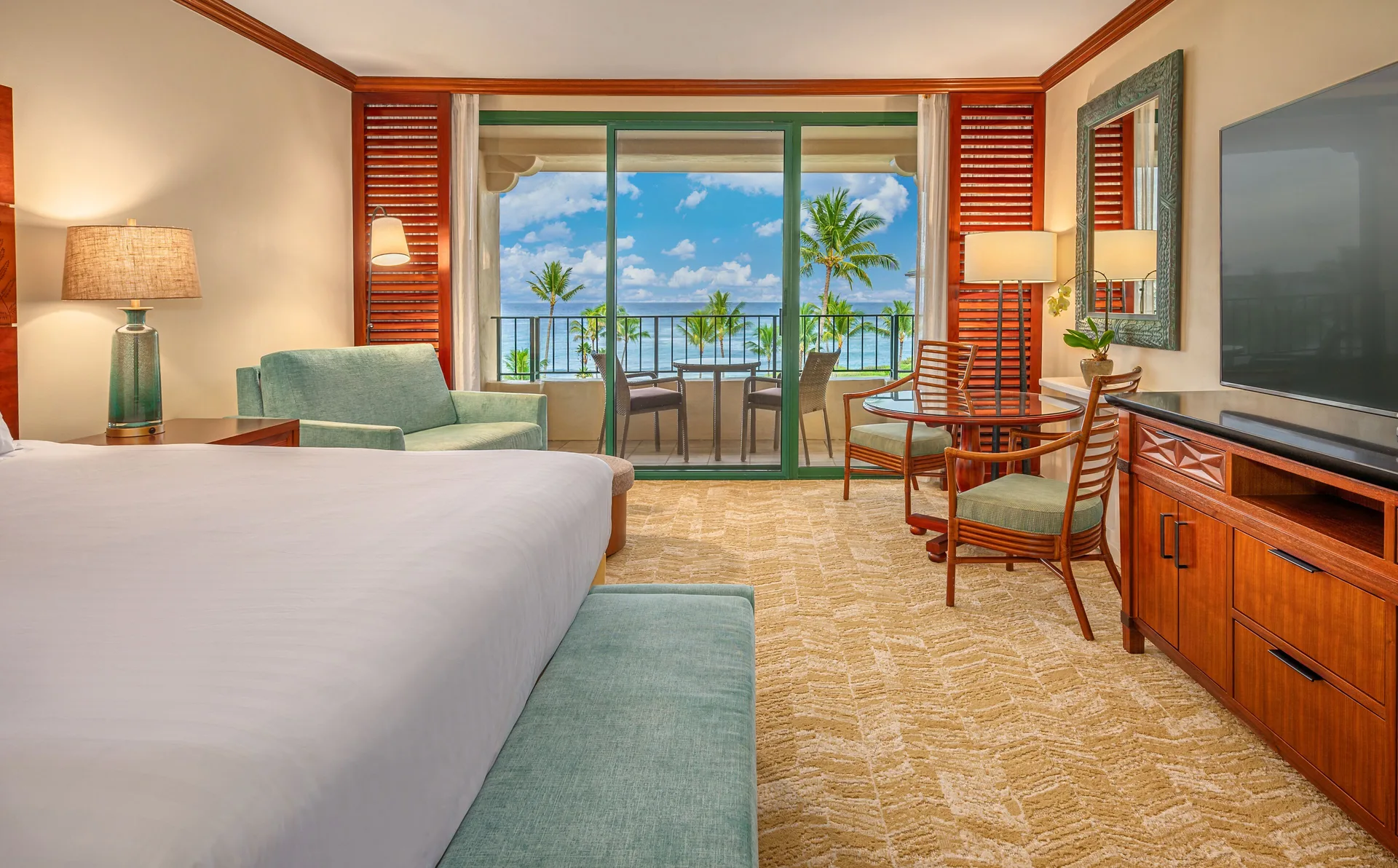 Ocean View room with bed, seating, balcony, and ocean beyond at Grand Hyatt Kauai Resort and Spa and Spa.