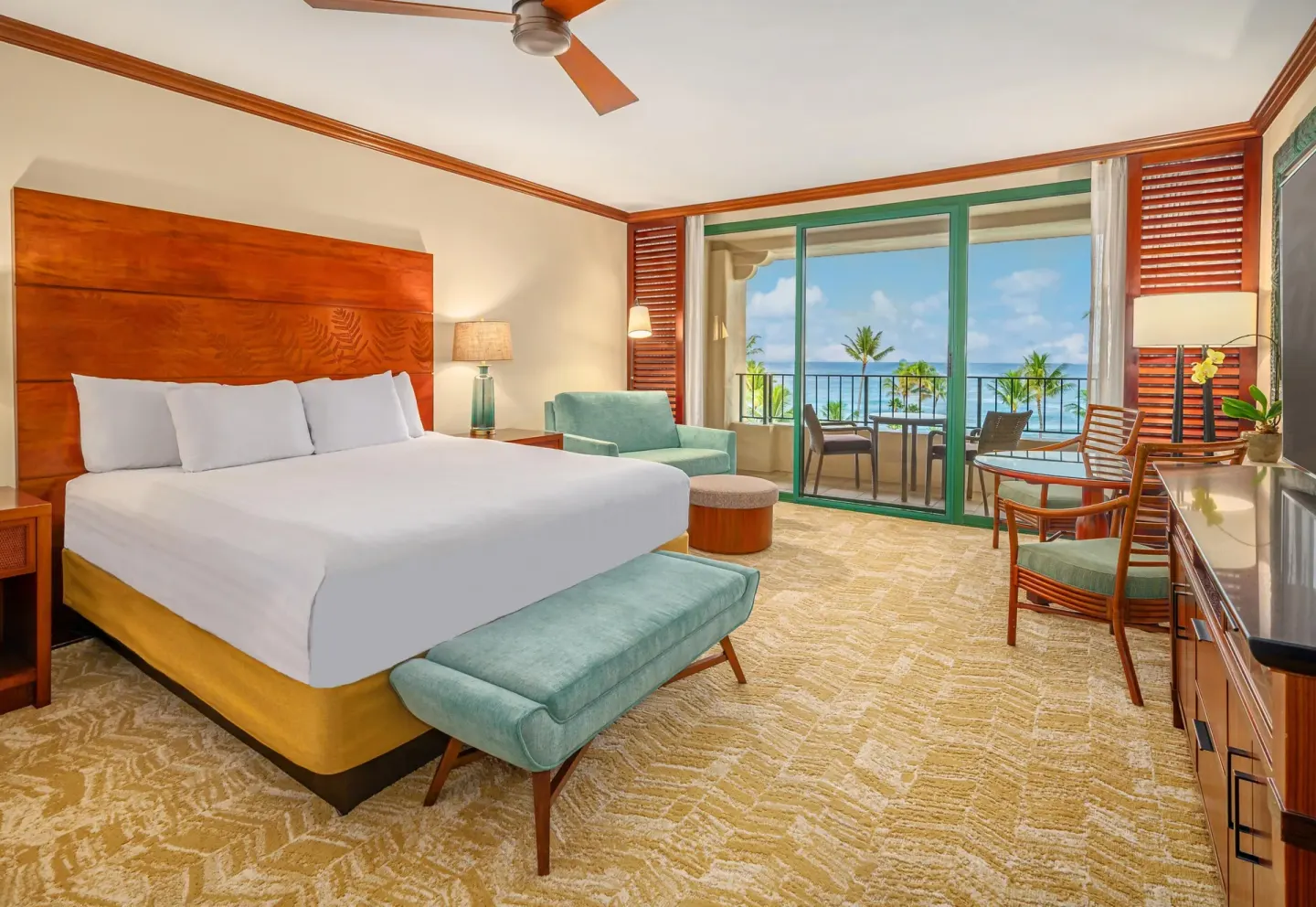 Ocean View room with king bed, lounge chair, balcony, and ocean at Grand Hyatt Kauai Resort and Spa and Spa.