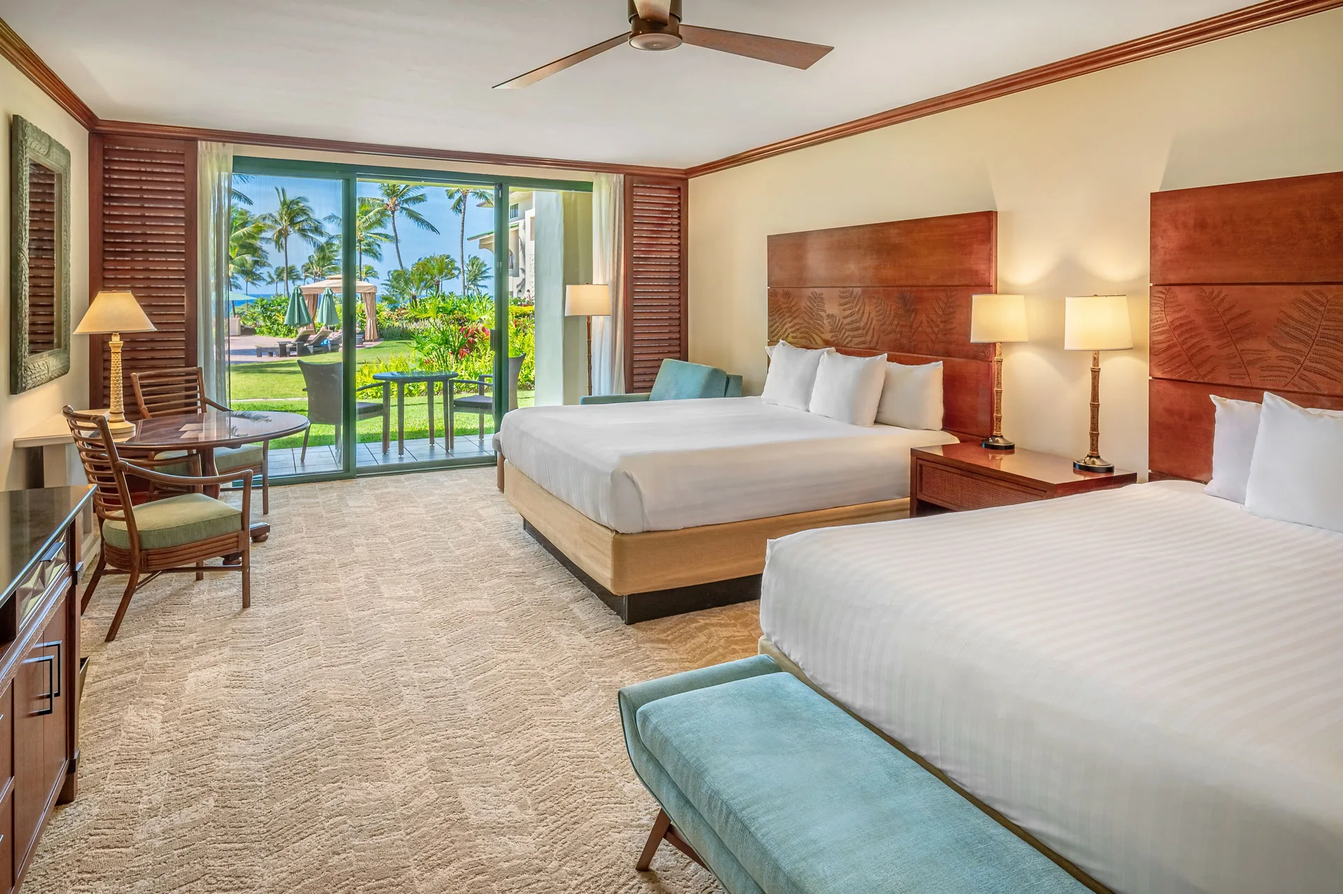 Two-bed partial ocean view room with patio at Grand Hyatt Kauai Resort and Spa and Spa.